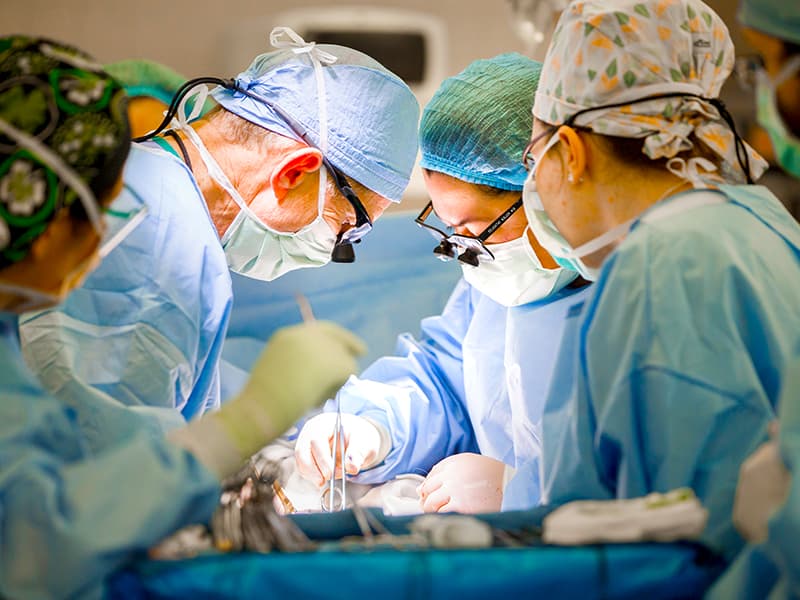 Abdominal transplant surgeons Dr. James Wynn, second from left, and Dr. Felicitas Koller, second from right, complete a kidney transplant in early 2021.